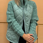 Teal quilted cardigan vest with front zipper and textured knit sleeve panels