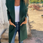 Long open-front revers cardigan, dark green knit, draped lapels and pockets