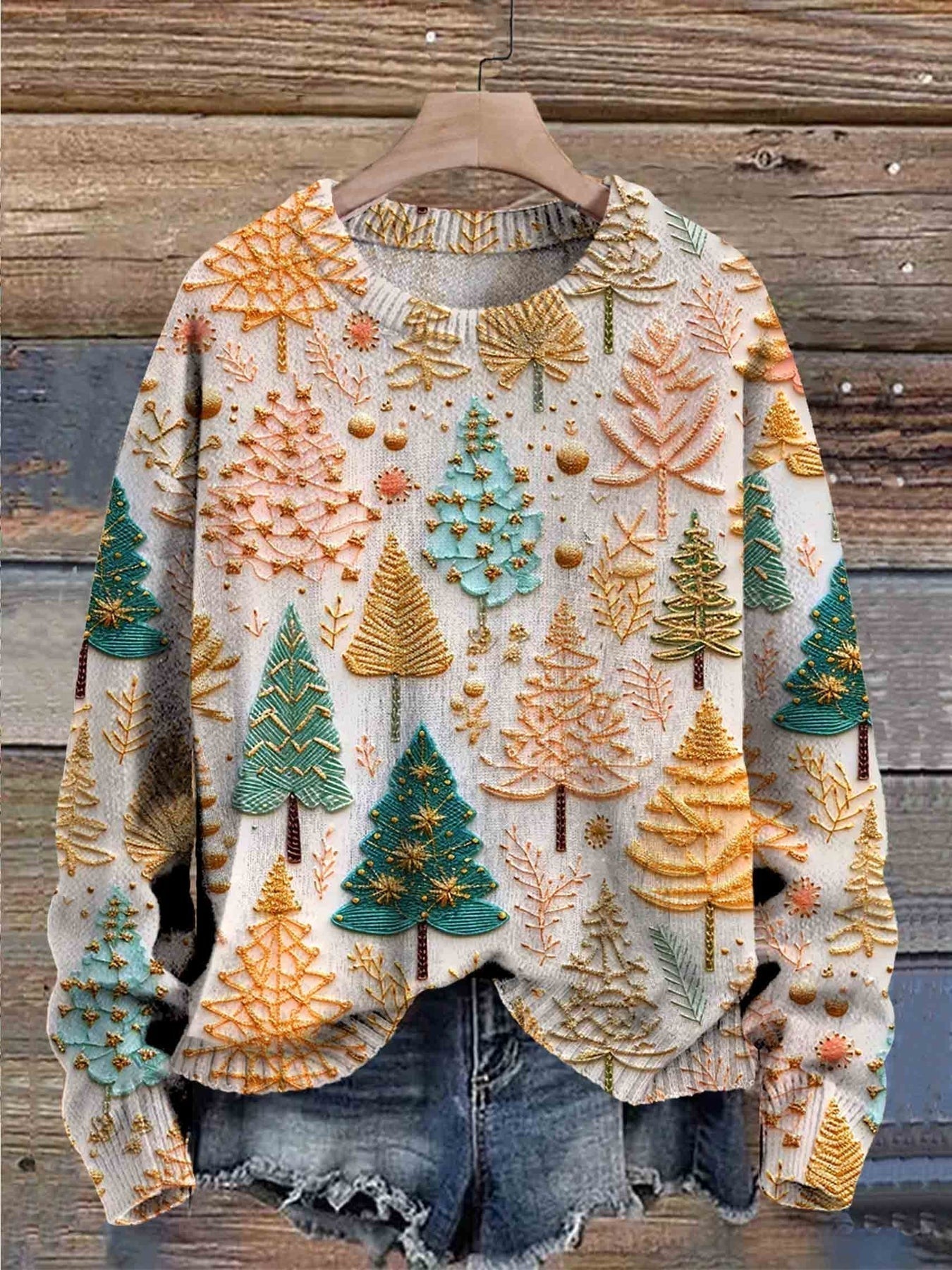 Festive knit sweater with light base, multicolor tree and ornament prints, crew neck
