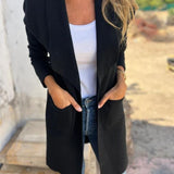 Long open-front revers cardigan in black knit, relaxed drape and side pockets