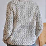 Womens knit pullover with crew neckline and allover speckled texture, long sleeves