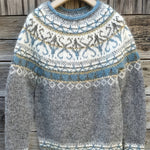 Gray knit pullover with blue crew neck and fair isle pattern, long sleeves