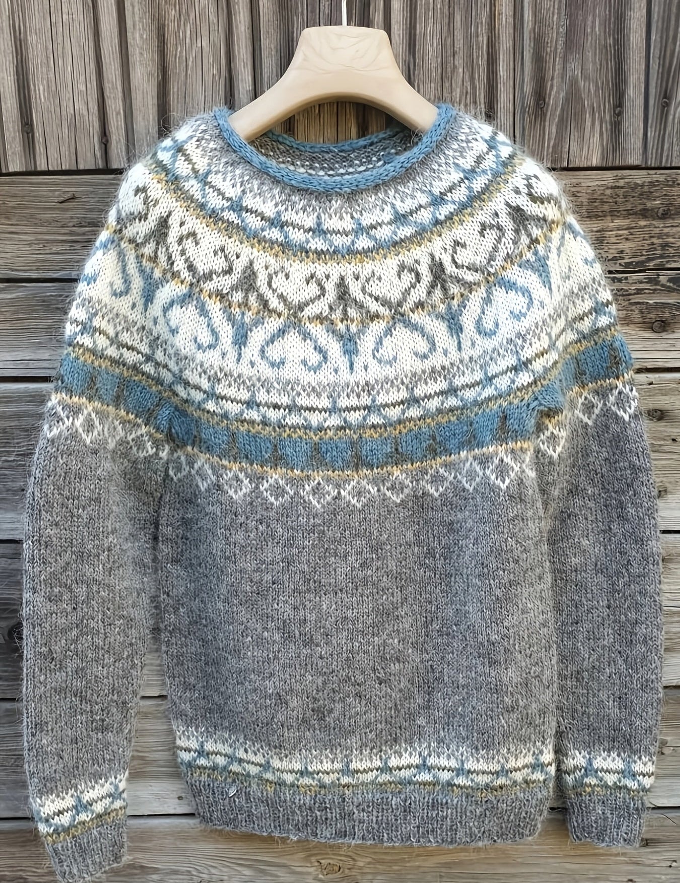 Gray knit pullover with blue crew neck and fair isle pattern, long sleeves