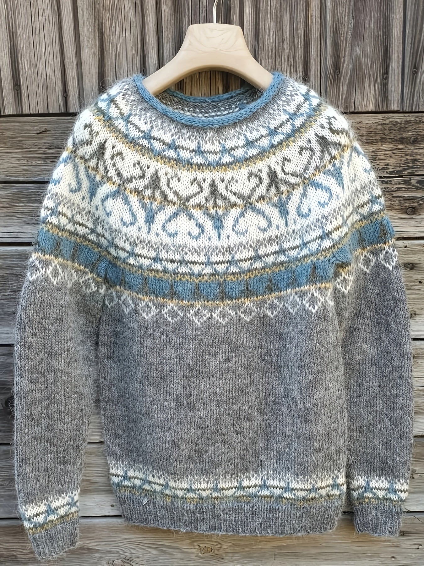 Gray knit pullover with blue crew neck and fair isle pattern, long sleeves