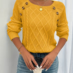 Mustard yellow cable-knit crewneck sweater with decorative shoulder buttons and ribbed cuffs