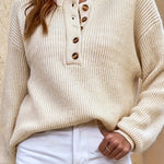 Beige knit pullover henley sweater with button-front placket and long sleeves