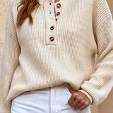 Beige knit pullover henley sweater with button-front placket and long sleeves