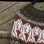 Olive Fair Isle knit pullover close-up with white patterned band at chest