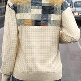 Cream knit sweater with square patchwork on upper back and waffle texture