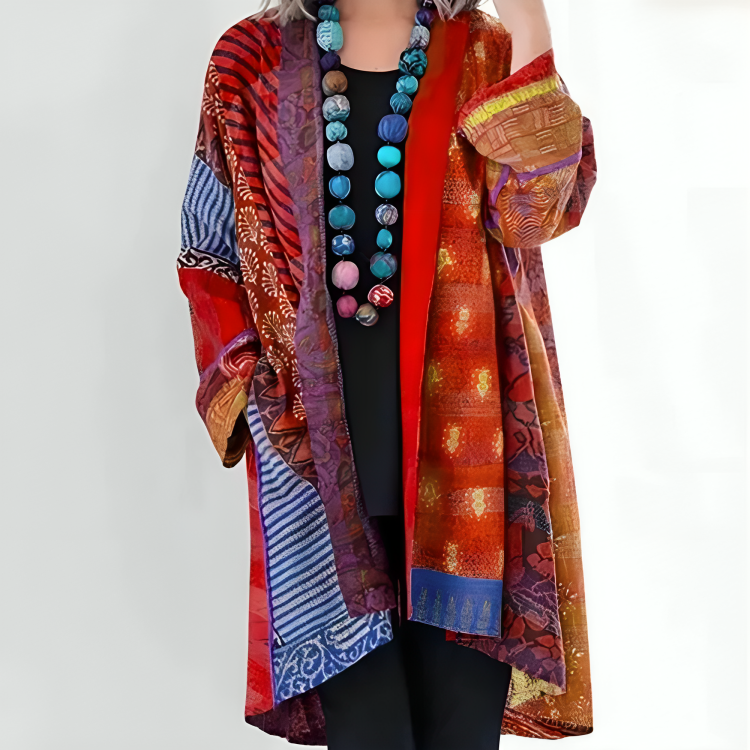 Multicolor knit cardigan with open front and long sleeves, orange and rust patchwork