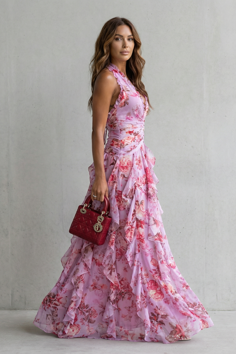 Pink floral halter maxi dress with ruched bodice and layered ruffle skirt, side view