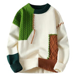 Color-block knit sweater in cream with green cable panel and brown accent pocket