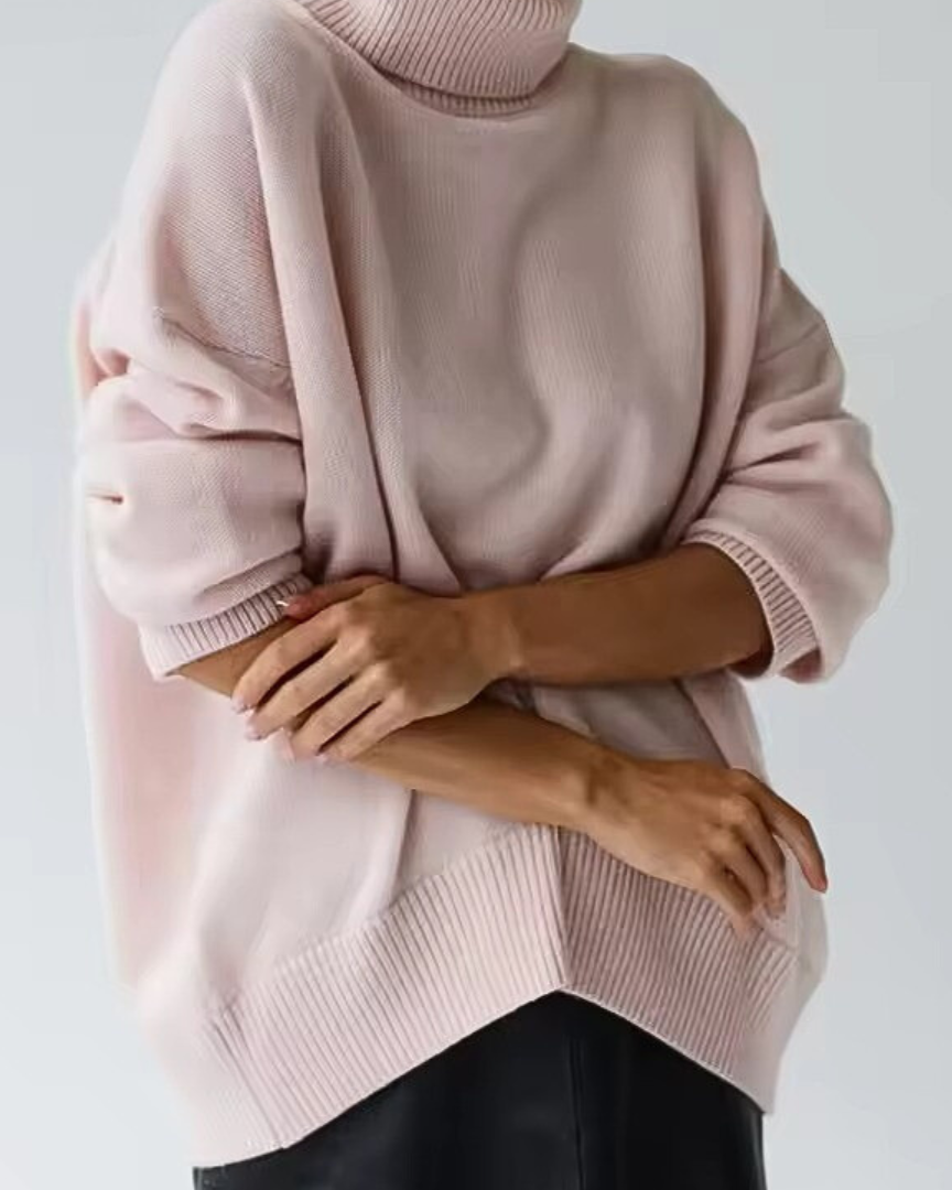 Oversized light pink turtleneck knit sweater with ribbed hem and cuffs