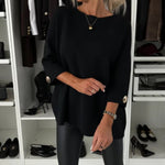 Black long-sleeve knit pullover with round neckline and buttoned cuffs