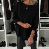 Black long-sleeve knit pullover with round neckline and buttoned cuffs