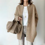 Tan open-front cardigan with long sleeves and snap-button placket