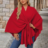 Red draped poncho with twist-knot front and wide sleeves