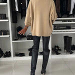 Beige knit pullover back view, loose fit with wide sleeves and ribbed hem