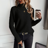 Black knit turtleneck sweater with long sleeves, textured knit and ribbed details