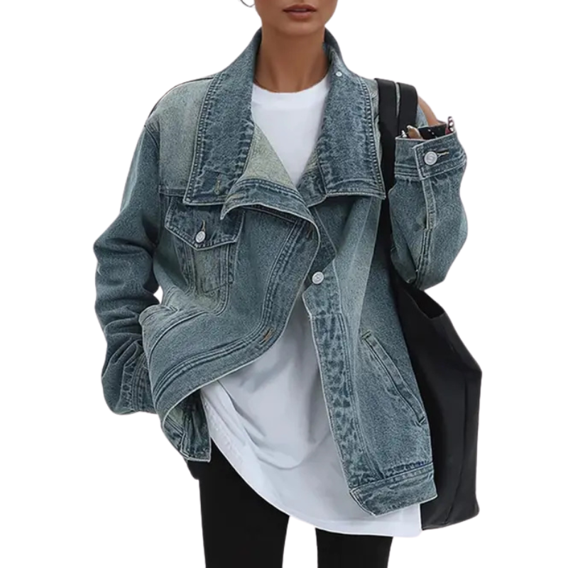 Asymmetrical denim jacket with high collar, flap chest pockets, and light vintage wash