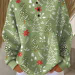 Green crewneck pullover with Christmas tree print, snowflakes, and red bows