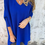 Royal blue V-neck pullover sweater with three-quarter sleeves and side split hem.