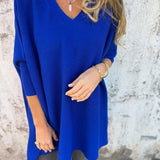 Royal blue V-neck pullover sweater with three-quarter sleeves and side split hem.