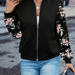 Black zip-front jacket with pink floral sleeve print and stand collar