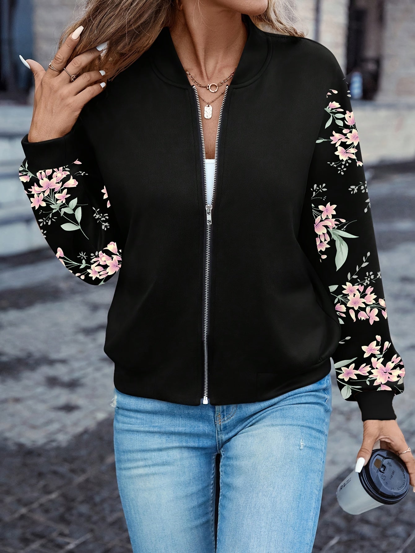 Black zip-front jacket with pink floral sleeve print and stand collar