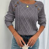 Gray cable-knit crewneck sweater with decorative shoulder buttons and ribbed cuffs