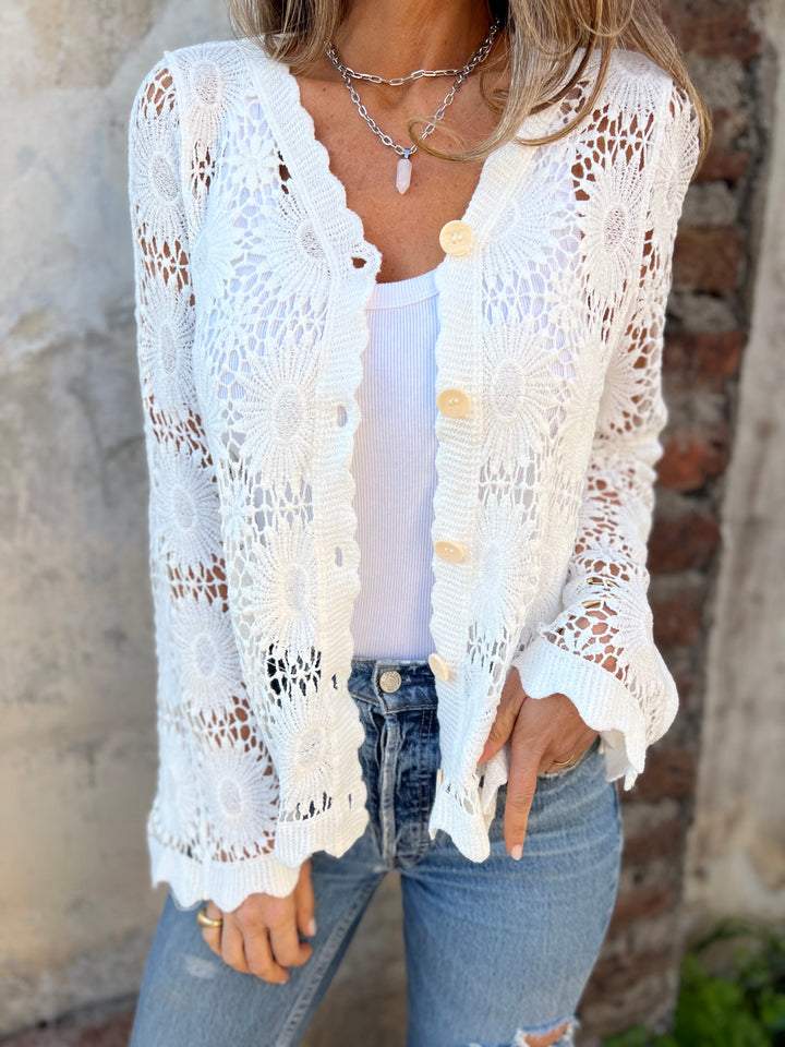 White openwork lace cardigan with V-neck and front buttons; long sleeves