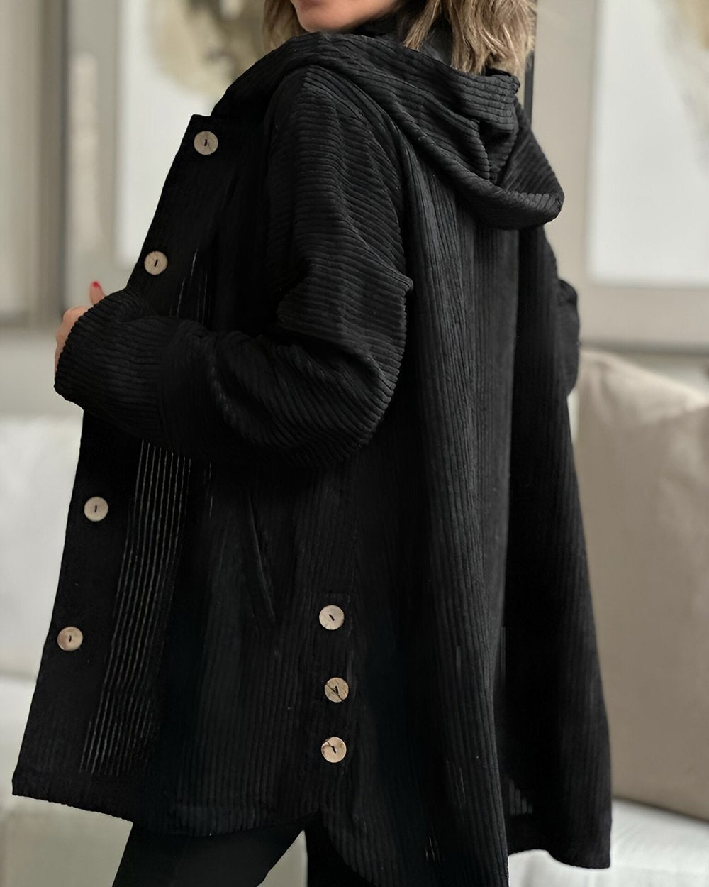 Black corduroy hooded jacket, button placket and hood detail