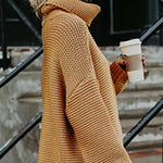 Orange roll-neck knitted sweater with long sleeves and cozy ribbed cuffs.