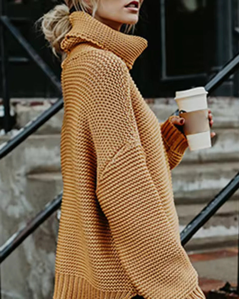 Orange roll-neck knitted sweater with long sleeves and cozy ribbed cuffs.