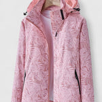 Light pink hooded jacket with front zipper and stand collar, leaf-patterned fabric