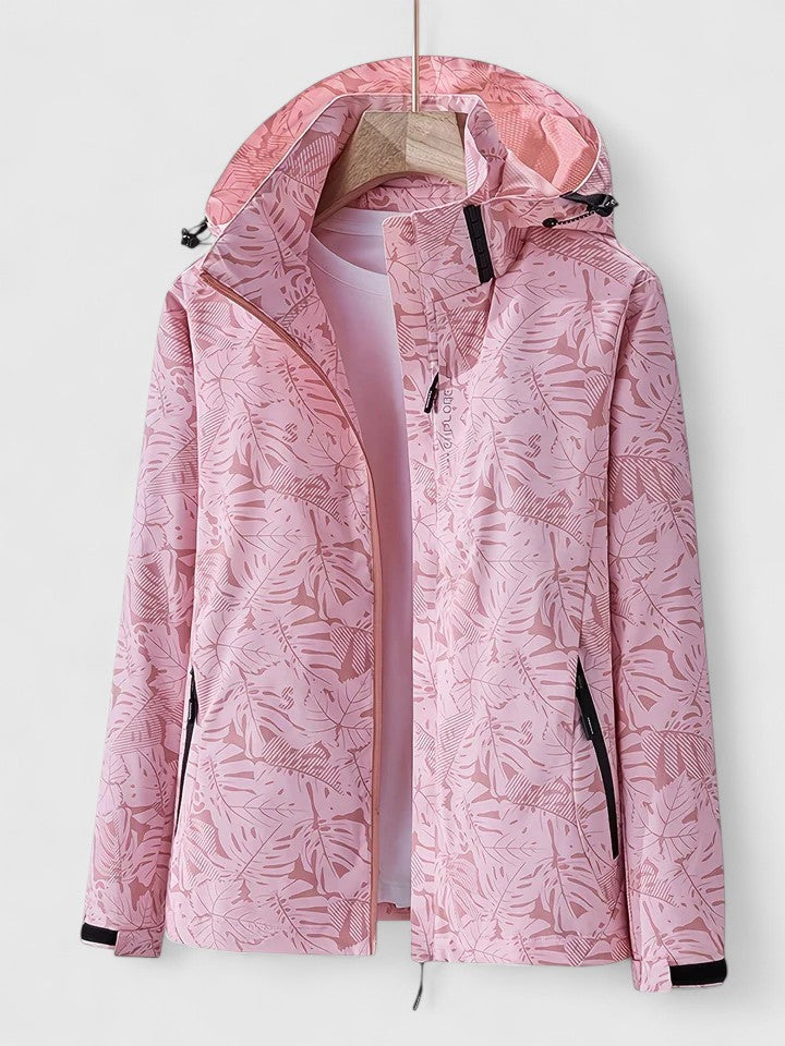 Light pink hooded jacket with front zipper and stand collar, leaf-patterned fabric