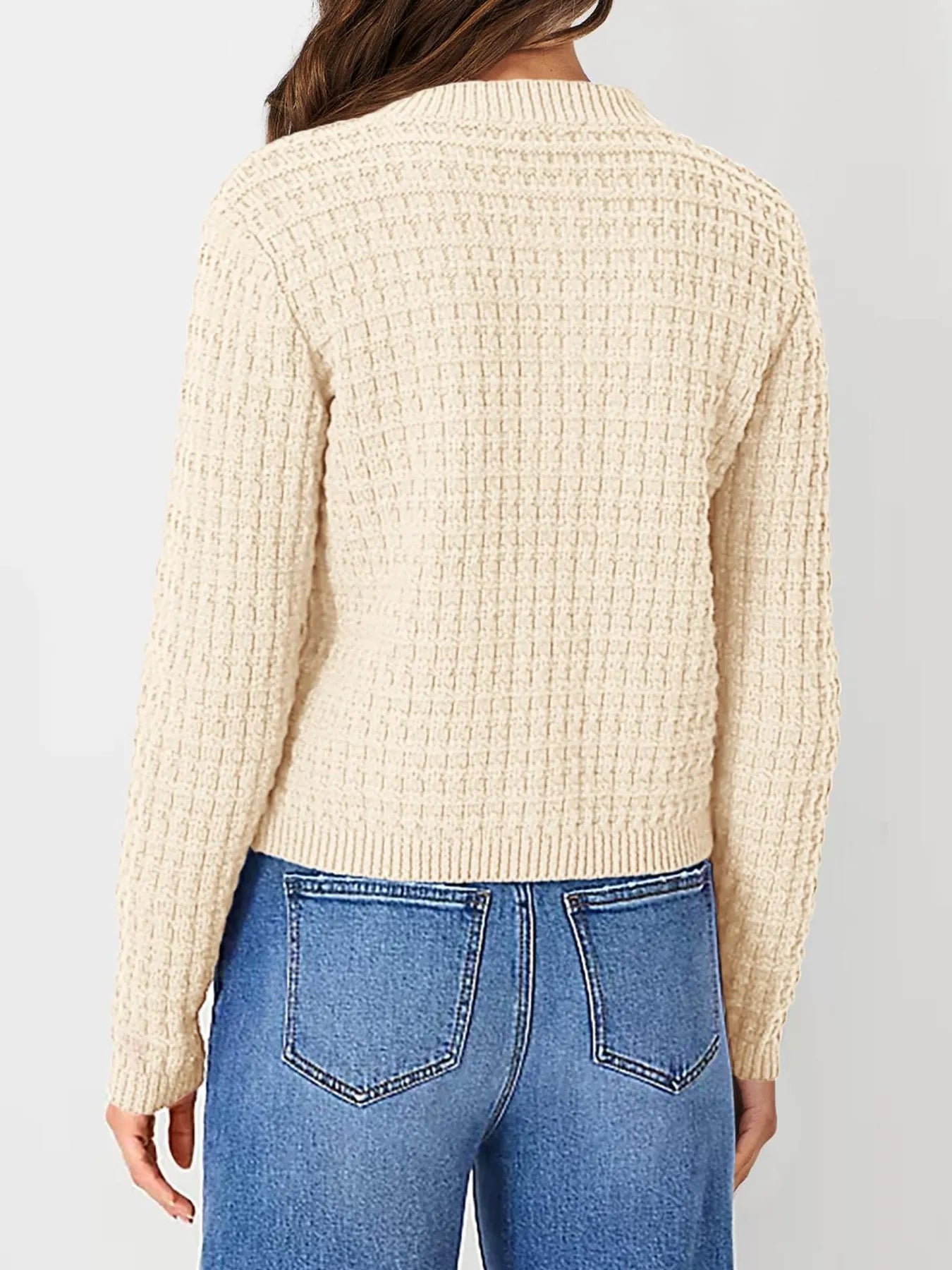 Cream knit cardigan back view with textured stitch pattern and ribbed waistband