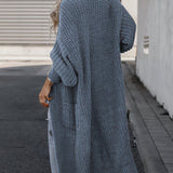 Blue long knit cardigan with open front, long sleeves, and side pockets