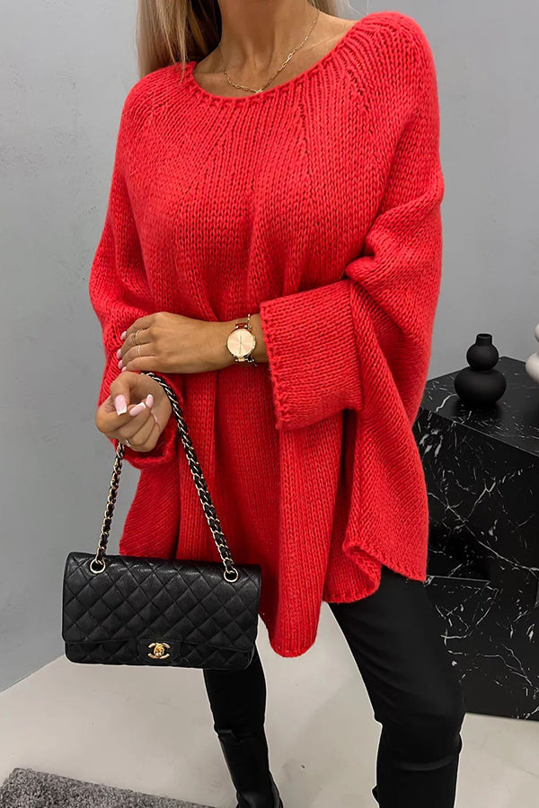Red knit pullover with textured stitch, loose batwing sleeves and crew neckline