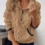Beige fuzzy quarter-zip pullover with short sleeves and navy-trim accents