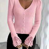 Pink V-neck ribbed top with button placket and lace bell cuffs