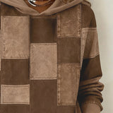 Brown patchwork hoodie close-up with hood and drawstring, stitched square panels