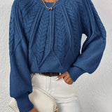 Blue cable-knit long-sleeve pullover with half-zip neckline and ribbed cuffs