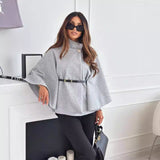 Gray belt jacket with button collar, wide cape sleeves, and cinched waist belt