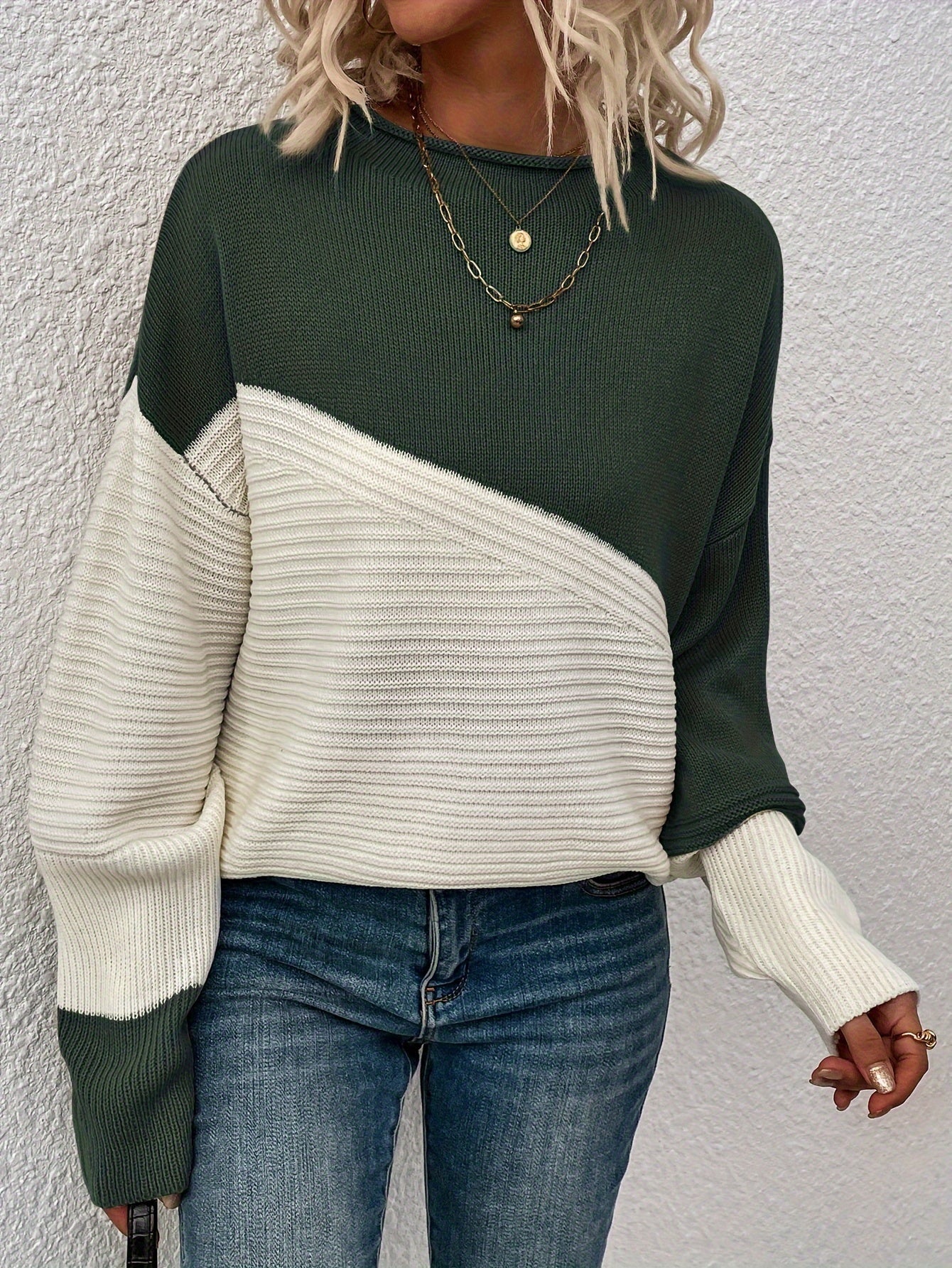 Dark green and white color-block pullover sweater with long sleeves and crew neck