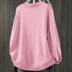 Light pink cardigan sweater, long sleeves with ribbed collar, cuffs, and hem