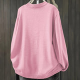 Light pink cardigan sweater, long sleeves with ribbed collar, cuffs, and hem