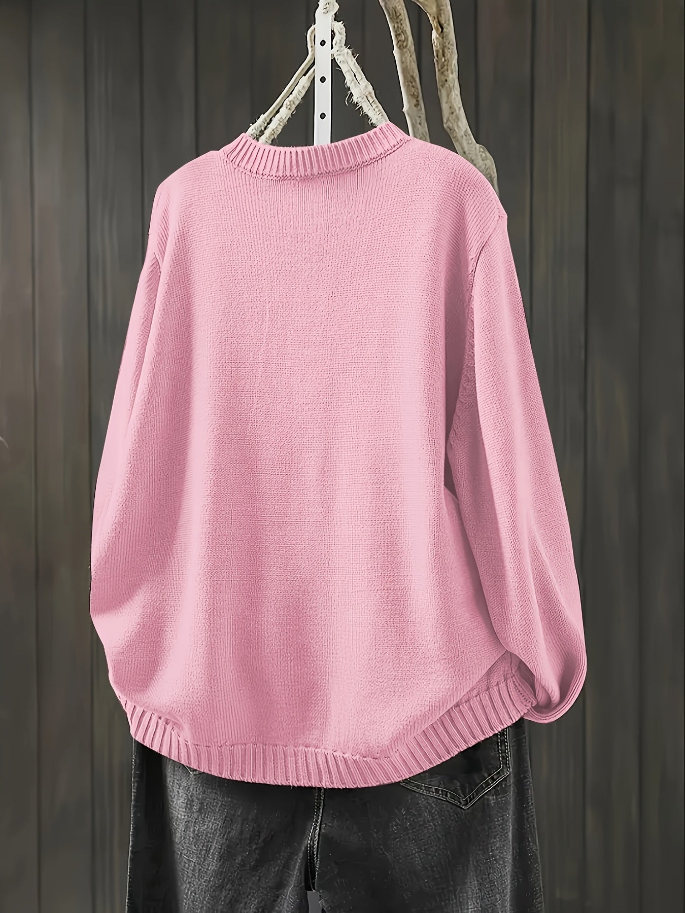 Light pink cardigan sweater, long sleeves with ribbed collar, cuffs, and hem