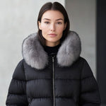 Black puffer jacket with gray faux fur collar and front zipper, worn by model