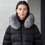 Black puffer jacket with gray faux fur collar and front zipper, worn by model